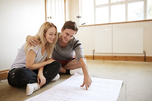 Couple look at renovation plans for their purchase plus improvements mortgage